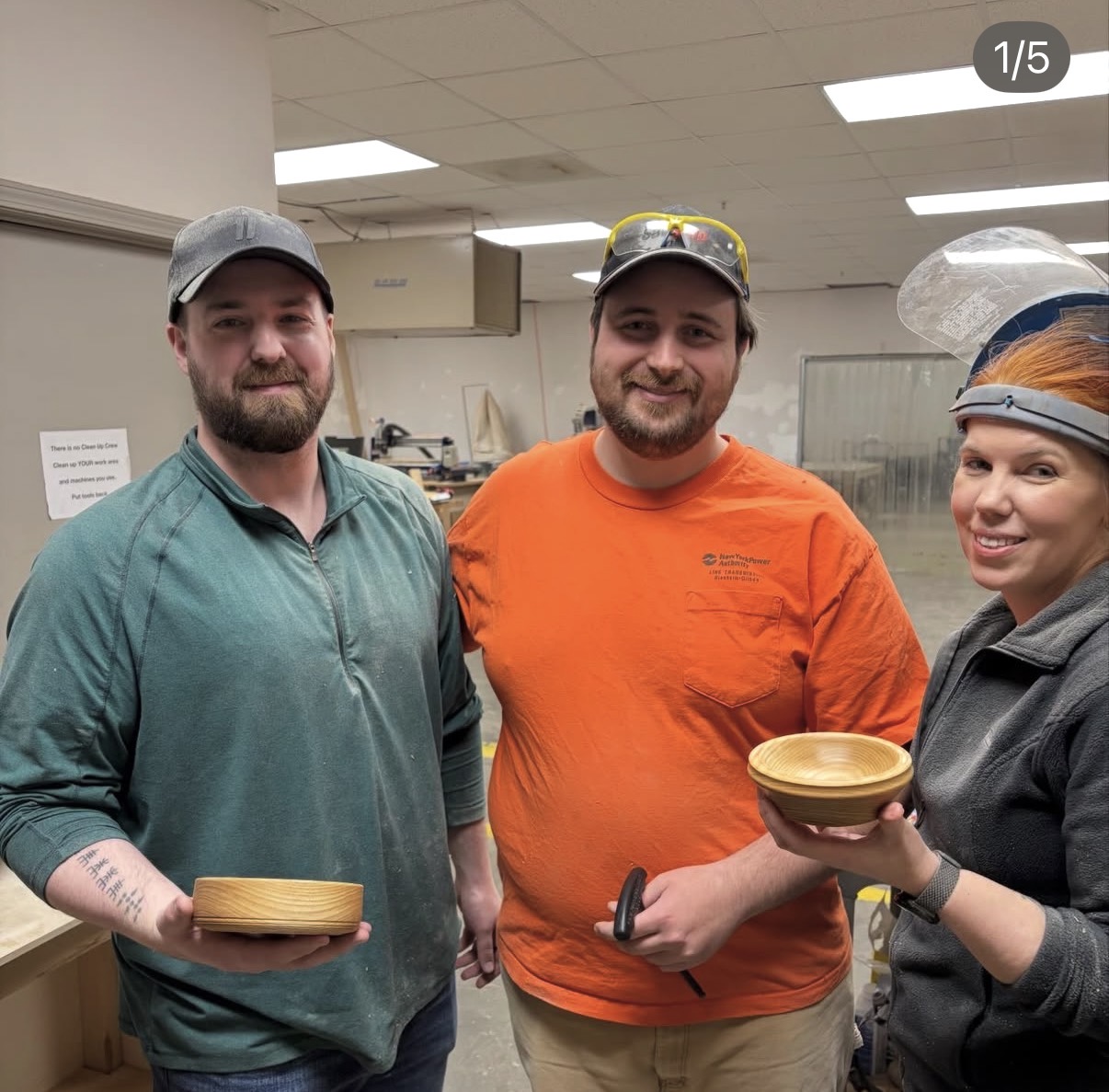 Matt teaching a beginner woodturning class with two students who turned their first bowls